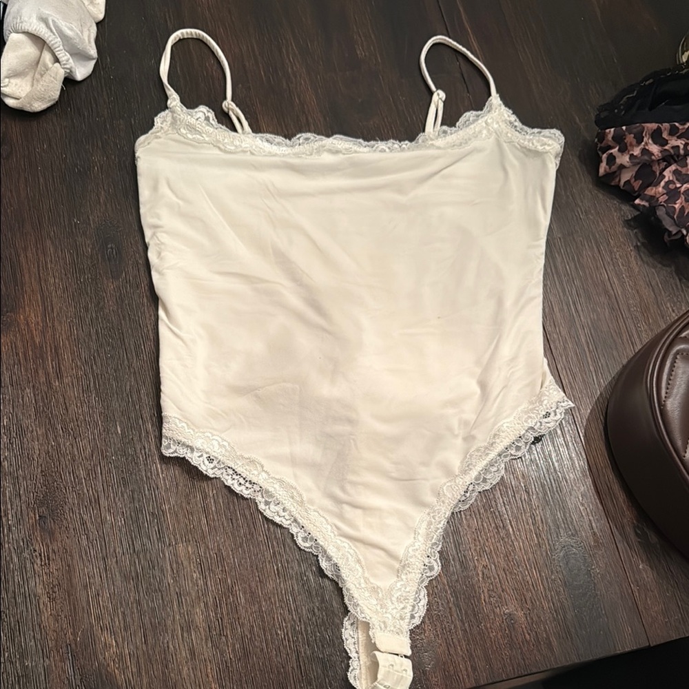 Elegant Cream Lace-Trimmed Bodysuit